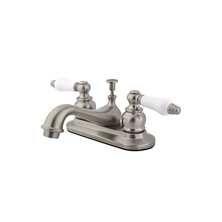 Kingston Brass Restoration Two Handle 4" Centerset Lavatory Faucet with Retail Pop-up image - 1