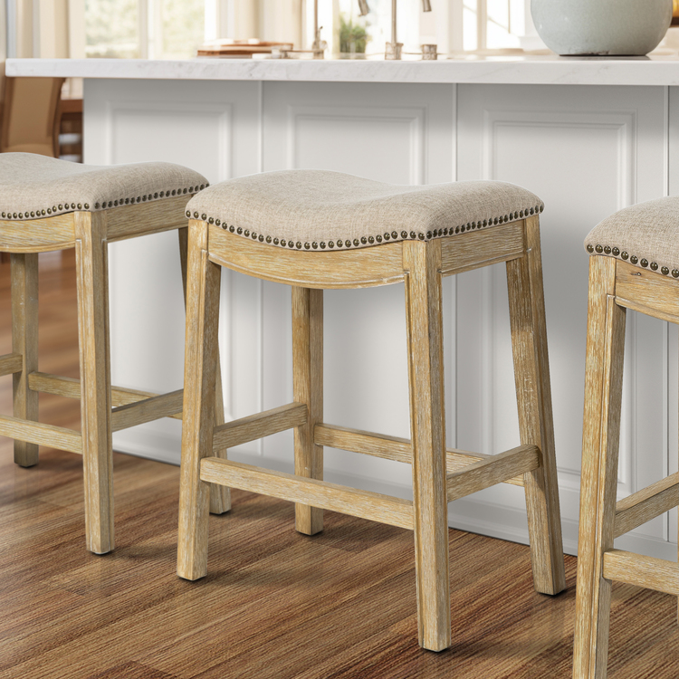 New Ridge Home Goods Sadie 26in. H Saddle Natural Wood Counter-Height Barstool with Cream Fabric image - 1